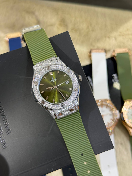 HUBLOT femme full serti vert / silver